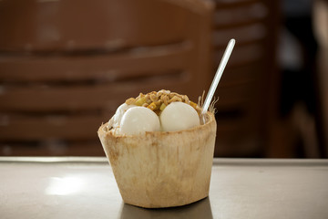 Coconut milk ice cream is delicious,Put the beans and sweet potato in coconut shell   
