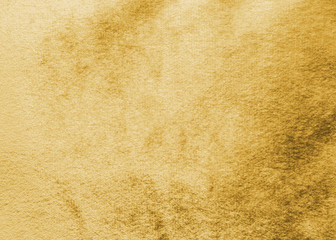 Gold velvet background or golden yellow velour flannel texture made of cotton or wool with soft...