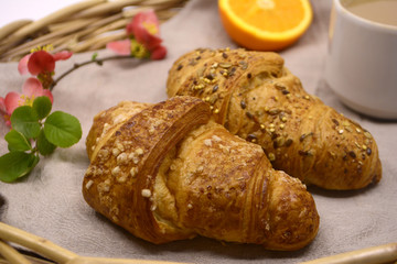 Croissants on a tray. Breakfast table. Morning concept