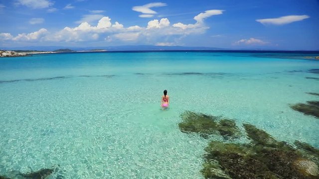 Young girl have a rest on a beach in Halkidiki, Greece