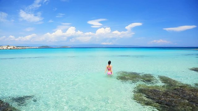 Young girl have a rest on a beach in Halkidiki, Greece