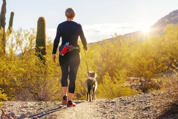 Garden poster Arizona Woman Hiking With Dog in Phoenix Arizona