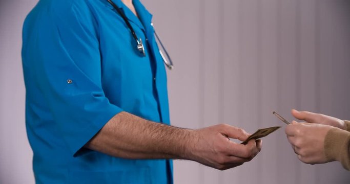 doctor taking bribes from patients