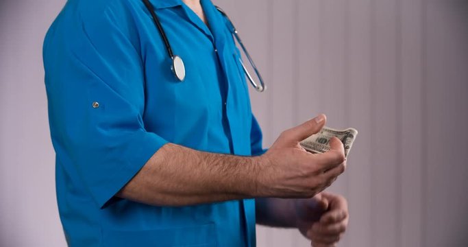 doctor taking bribes from patients