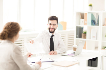 Businesswoman signed a contract and businessman very satisfied about this