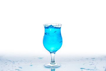 Glass and water splash in white background
