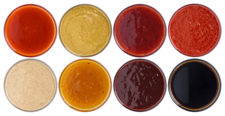 Different sauces isolated on white background © xamtiw