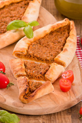 Turkish pide pizza with meat and onion. 