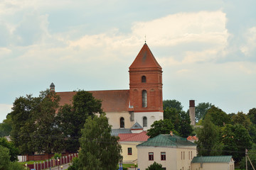 Fototapeta na wymiar Mir, Belarus. Landscape Of Village Houses And Church Mir, Belarus.