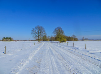 Fototapeta premium Endless expanses in snow-covered Latgale, in winter 2018.