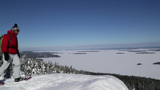Snowshoe hiker on Paha-Koli enjoys the winter landscape