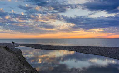 the confluence of a small river in the sea.