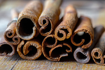 Spices for cooking with kitchen accessories on an old background
