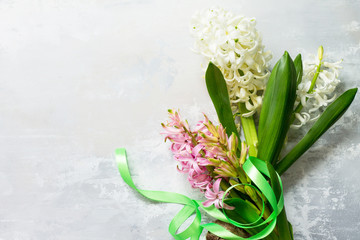 Bouquet of hyacinth flower on stone background or slate. Spring flowers background. Top view flat lay background.