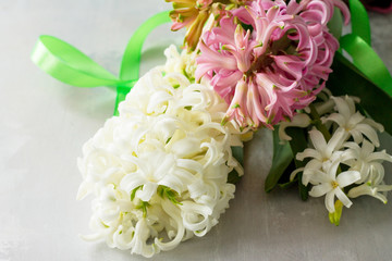 Bouquet of hyacinth flower on stone background or slate. Spring flowers background.