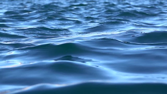 detail of sea wave moving in slow motion ripples nautical blue background