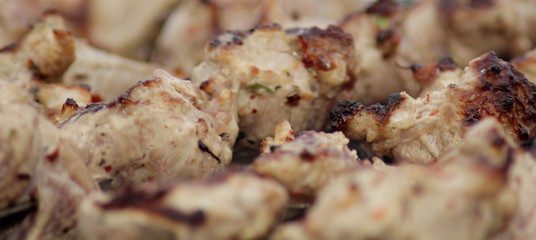 fried meat on charcoal