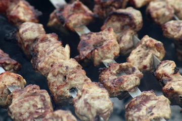 fried meat on charcoal