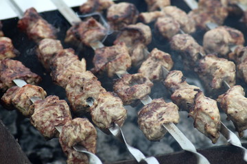 fried meat on charcoal