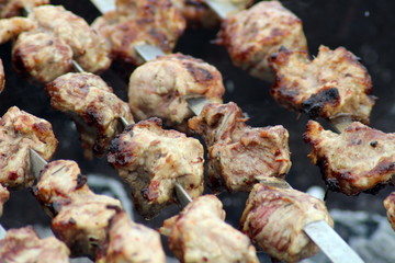 fried meat on charcoal