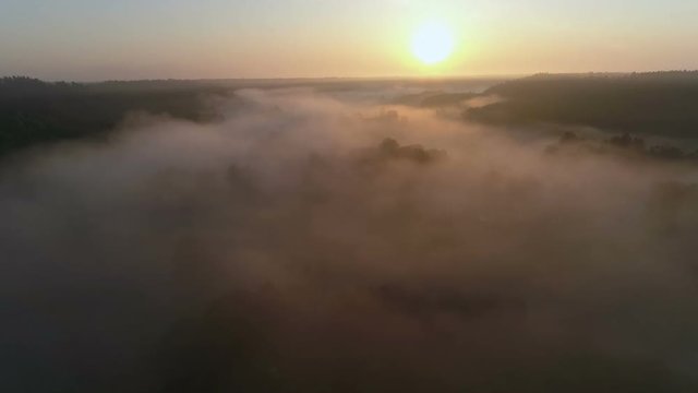 Sunrise Drone footage above the fog and river