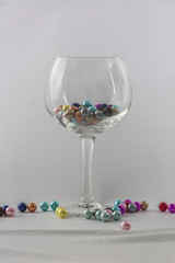 wine glass and small balls