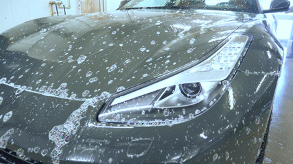 A car in foam, car washing.