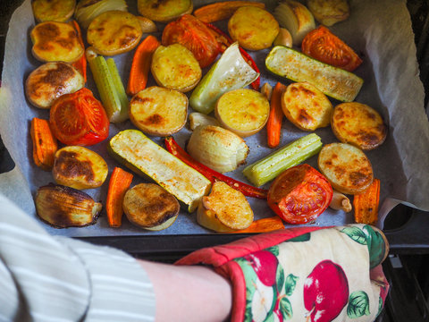Baked vegetables get from the oven.