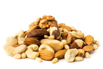 Bunch of different nuts on white background, close up.