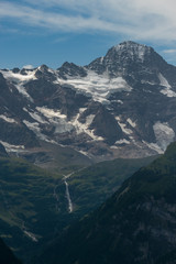 Naklejka premium Snow capped mountain in the summer. Bernese Alps, Switzerland