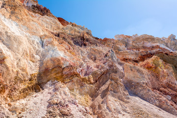 Fototapeta na wymiar Multicolored rocks on Firiplaka Beach on Milos island. Cyclades, Greece