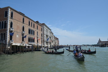 A few gondolas somewhere on the canal in Venice