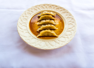 Potstickers/Dumplings On White Plate