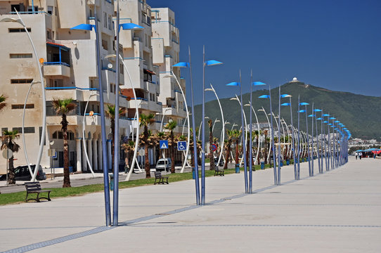 Promenade in Martilu near the Mediterranean Sea with a white water reservoir on the horizon. Morocco. Africa.