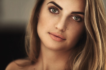 Obraz premium Elegant girl with a beautiful make-up. Blonde hair.