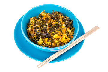 Vegetable salad with sea kale in blue bowl