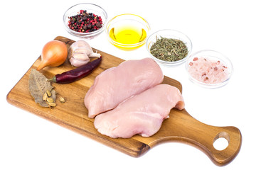 Raw chicken meat fillet on cutting board