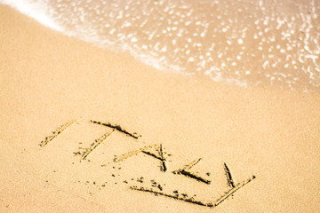 writing on the beach italy