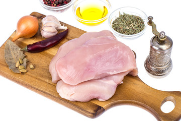 Raw chicken meat fillet on cutting board