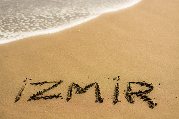 Fototapeta na wymiar writing on the beach izmir
