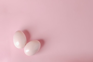 Pink pastel easter eggs on blue background