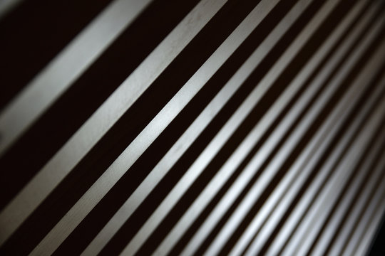 Some parallel lines creating a diagonal background. Low key backdrop.