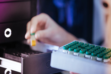scientist working with vials analysis in the laboratory