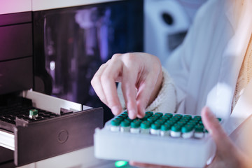 scientist working with vials analysis in the laboratory