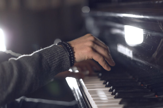 Hands of the pianist on the piano