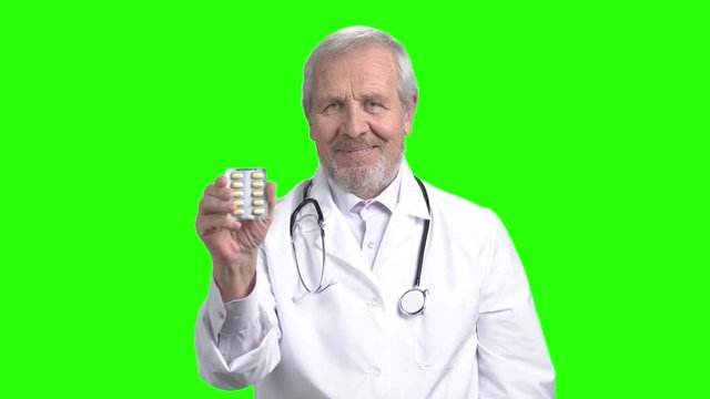 Advertising of good pills. Green screen hromakey background for keying.