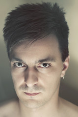 Fototapeta premium Young man with piercings artistic studio shot