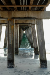 View from Below of Traditional American Pier on Beach