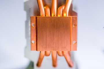 Aluminum radiator with copper heat pipe close-up with beautiful bokeh Concept of air cooling of the...
