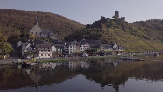 Flight over Beilstein town and autumn vineyards, Mosel valley, Germany. Original untouched LOG format.
